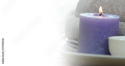 Image of white background over towels and candle