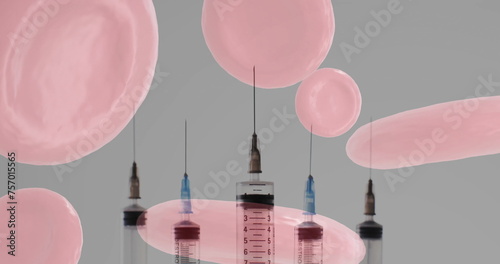 Image of red blood cells and syringes on grey background