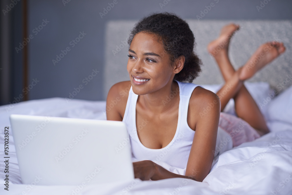 Black woman, laptop or bed to relax as thinking of idea for social media, post, blog or meme. Female writer, lying or computer as planning, vision or daydreaming of viral news to search online Black woman, laptop or bed to relax as thinking of idea for social media, post, blog or meme. Female writer, lying or computer as planning, vision or daydreaming of viral news to search online