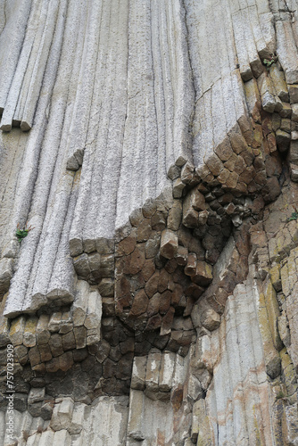 texture of porous stones on the beach, nature, natural phenomena, grey stones, columnar stones, lava rocks                     photo