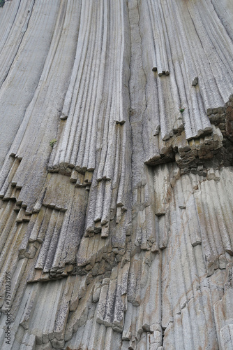 texture of porous stones on the beach, nature, natural phenomena, grey stones, columnar stones, lava rocks                     photo