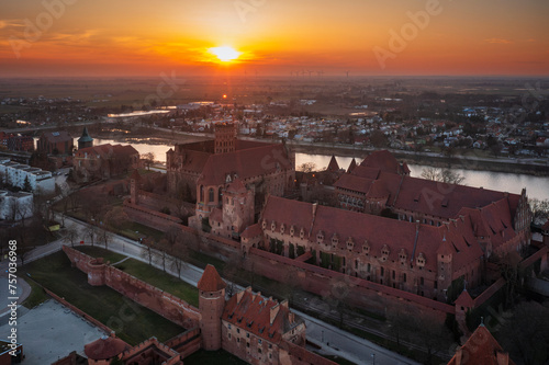 Malbork castle over the Nogat river at sunset, Poland