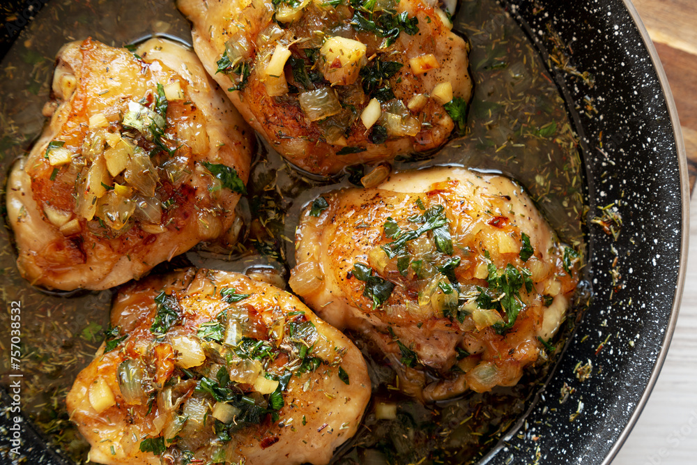 Homemade Garlic Brown Sugar Chicken in a Pan, top view. Close-up. Homemade Garlic Brown Sugar Chicken in a Pan, top view. Close-up.