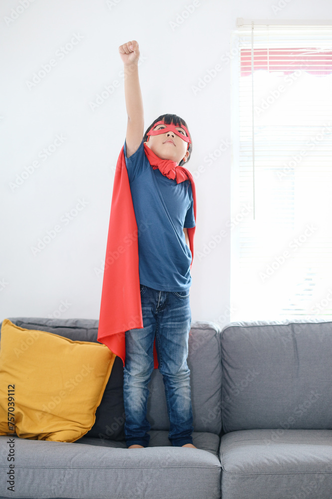 Superhero Kid Raise Up Right Hand  As If To Fly, Playing Action Figure at Home. 