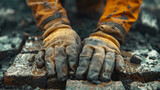 Worker's hands laying bricks