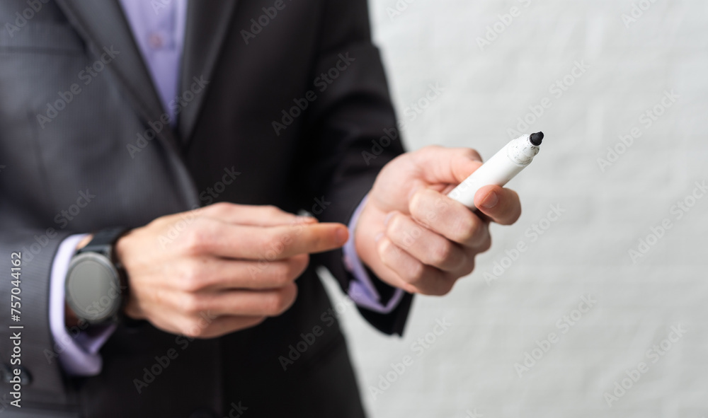 Hand writing with a white felt-tip pen on white background Hand writing with a white felt-tip pen on white background