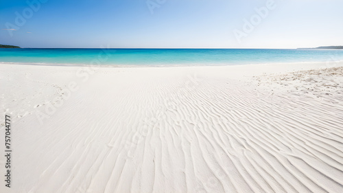 Beautiful white sand beach with turquoise water and blue sky