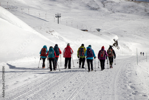 A group of hikers trekking at Mont-Cenis, a massif of the French Alps