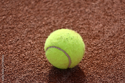 Tennis ball on clay court. © Zoran