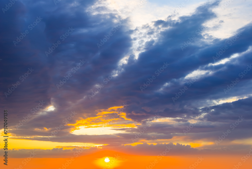 dramatic sunset on cloudy sky background