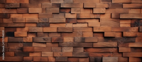 A detailed closeup of a brown hardwood wall made of rectangular wooden squares  showcasing the beautiful brickwork pattern and natural wood flooring