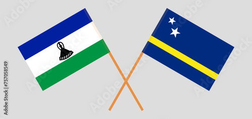 Crossed flags of Lesotho and Country of Curacao. Official colors. Correct proportion