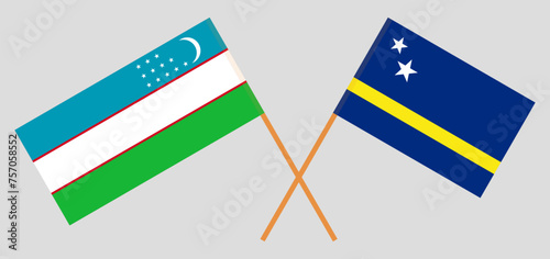 Crossed flags of Uzbekistan and Country of Curacao. Official colors. Correct proportion