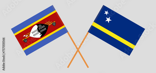 Crossed flags of Eswatini and Country of Curacao. Official colors. Correct proportion