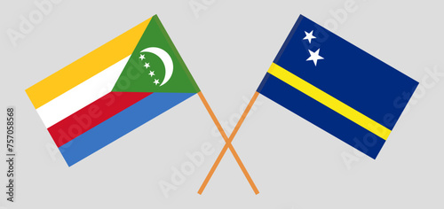 Crossed flags of the Comoros and Country of Curacao. Official colors. Correct proportion