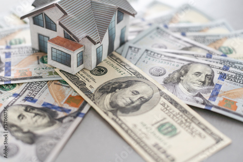 Small Model House on Newly Designed U.S. One Hundred Dollar Bills.