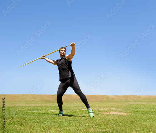 Man, workout and javelin throw or sport competition on grass for athlete fitness or outdoor, strength or training. Male person, challenge and target strong or exercise performance, aim or wellness
