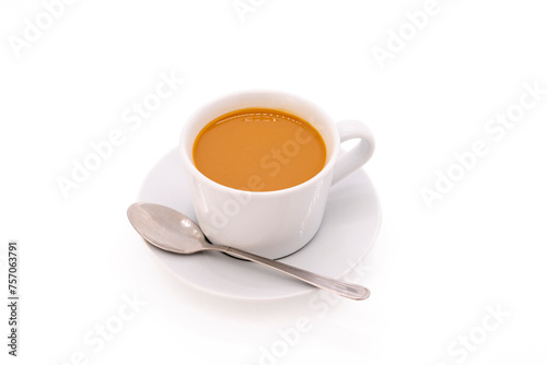 Creamy coffee on a white porcelain cup, isolated on white background with copy space.