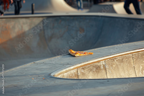 Abandoned Pizza Slice at Skatepark - Quiet Afternoon Snack Leftover
