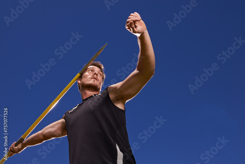 Fotografía Man, athlete and javelin throw for competition sport with arm strength for performance practice, challenge or blue sky