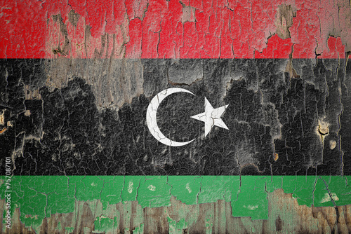 Libya flag painted on the cracked wall