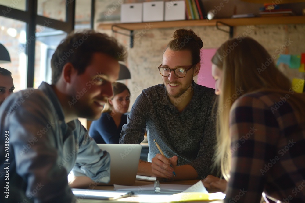 Teamwork in action. A team of professionals collaborating on a task, brainstorming and solving problems Teamwork in action. A team of professionals collaborating on a task, brainstorming and solving problems