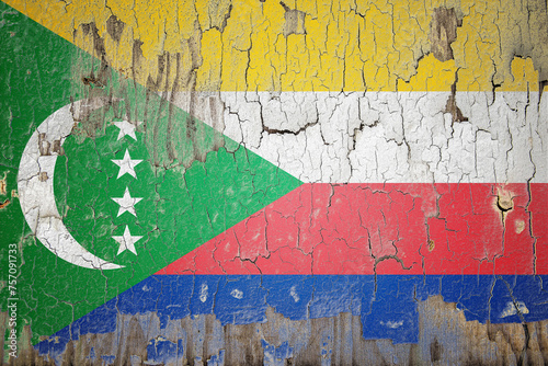 Comoros flag painted on the cracked wall