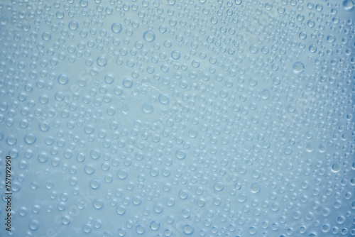 Water drops on blue background. Abstract water drops texture. Close up.