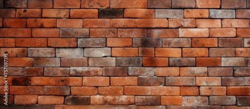 A detailed closeup of a brown brick wall showcasing the intricate patterns and textures of the brickwork. The facade is a beautiful example of this classic building material