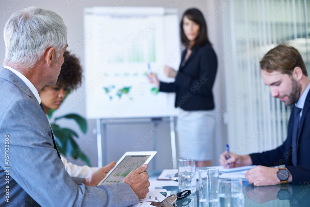 Obraz premium Businesswoman, presentation and conference room with graphs for teamwork report or growth, development or charts. Female person, colleagues and company strategy or finance sales, meeting or tablet