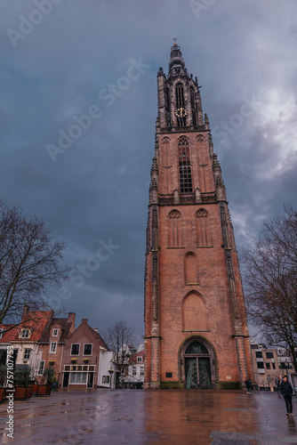 Medieval church tower Onze Lieve Vrouwetoren on a rainy day in Amersfoort, Netherlands. Gothic monument in town and the third highest church tower in Holland photo