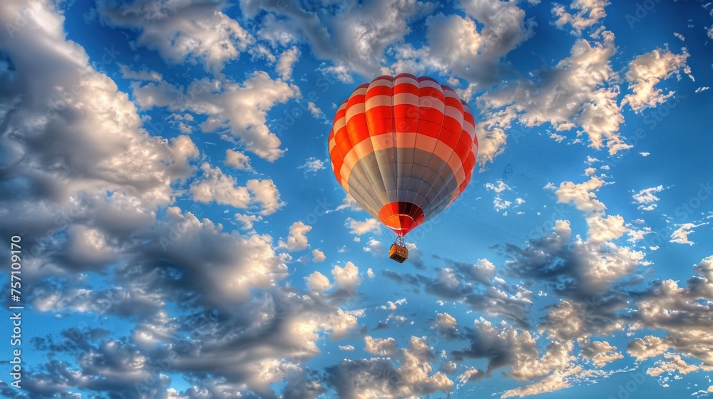 Fototapeta premium A hot air balloon floats gracefully in the sky.