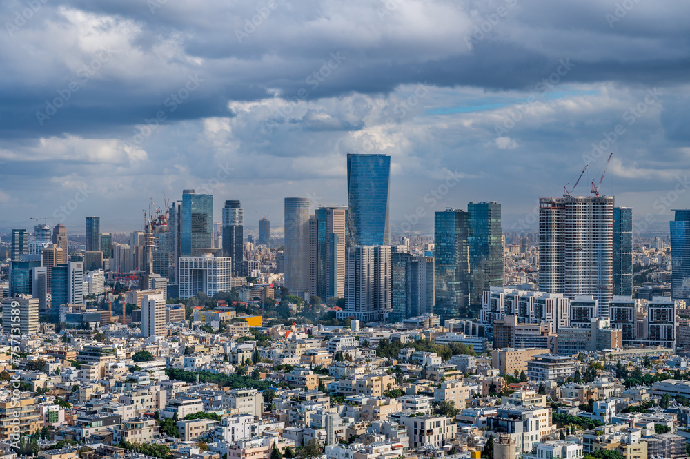 Tel Aviv old buildings and skyline of modern skyscrapers of Sarona and Ayalon districts. Tel Aviv old buildings and skyline of modern skyscrapers of Sarona and Ayalon districts.