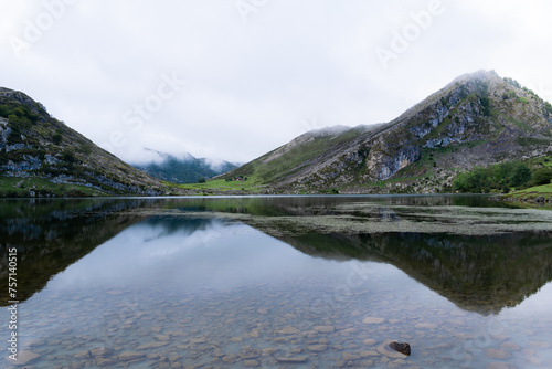 Majestic View Of Lake Enol Covered With Fog On A Rainy Day. The Lakes Of Covadonga. Asturias - Spain