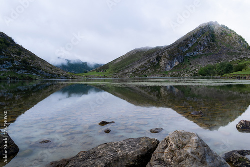 Fototapeta Naklejka Na Ścianę i Meble -  Beautiful view of Lake Enol with fog and rain. The Lakes of Covadonga. Asturias - Spain