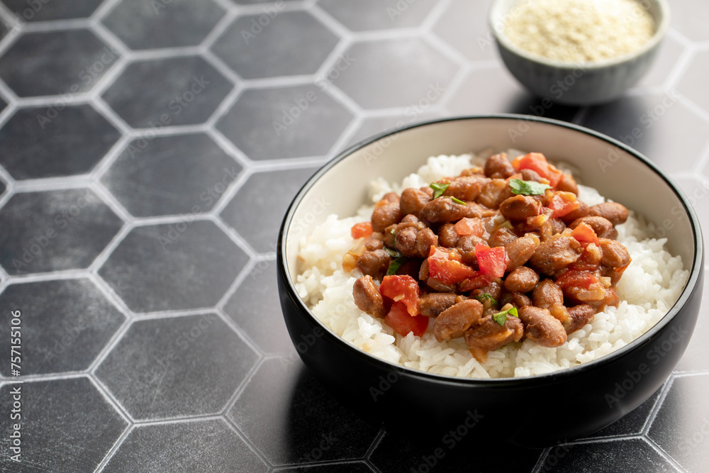 Vegan bean curry with rice and tomatoes. Indian cuisine. Vegetarian dish. Vegan bean curry with rice and tomatoes. Indian cuisine. Vegetarian dish.