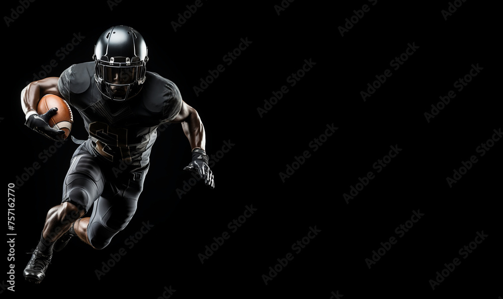 An American football player in a black helmet and uniform runs with a ball in his right hand in the right part of the frame on a black background