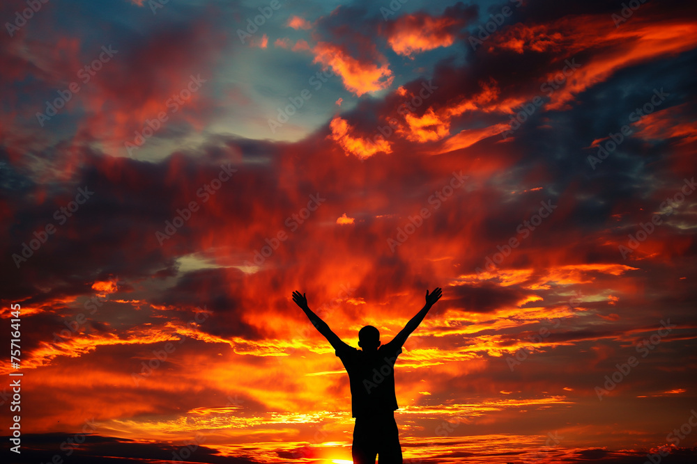 Silhouette of a Man Celebrating at Sunset Silhouette of a Man Celebrating at Sunset