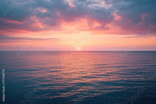 Witness the captivating sight of the sun setting over the ocean on a cloudy day, beautifully merging the celestial and aquatic realms, A gentle blend of sunset hues over a placid ocean, AI Generated