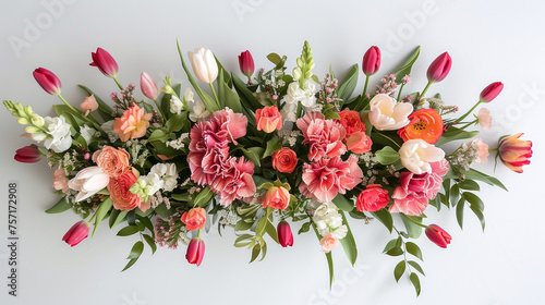 A whimsical display of tulips, snapdragons, and carnations arranged gracefully on a white canvas, inviting the essence of spring and summer holidays. Top view