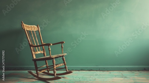 A wooden rocking chair gently leans against a vibrant green wall