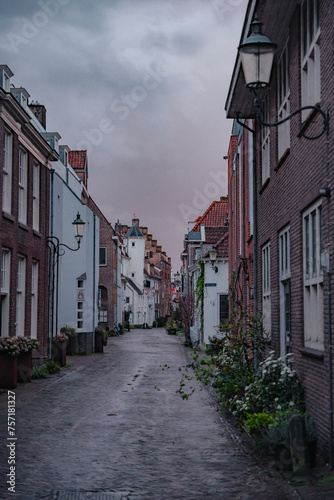 Amersfoort Netherlands  March 26 2023  Historic medieval city center on a rainy day. Narrow street with medieval houses in the historic center of Amersfoort at dusk.