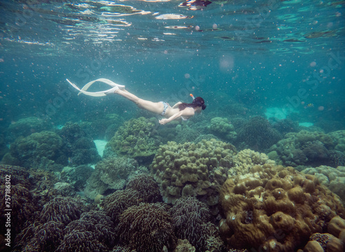 A tourist woman snorkeling near Lipe island, a small island in Thailand in Satun, Thailand