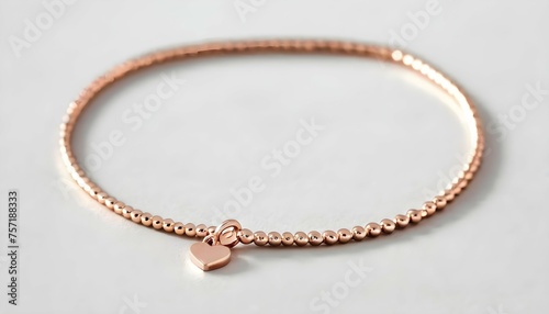 A Delicate Rose Gold Bracelet Adorned With A Tiny Upscaled 9
