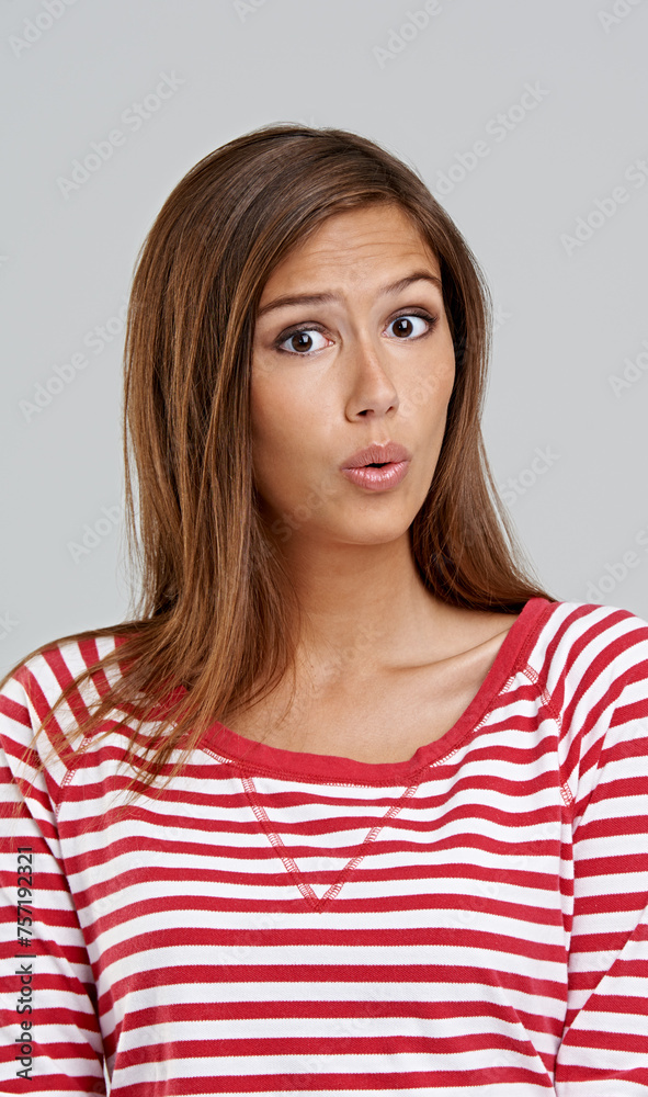 Face, woman and surprise for fashion in studio on grey background with casual wear and smart in confidence. Portrait, female person and wow, mistake or shock with outfit, clothes and trendy style Face, woman and surprise for fashion in studio on grey background with casual wear and smart in confidence. Portrait, female person and wow, mistake or shock with outfit, clothes and trendy style