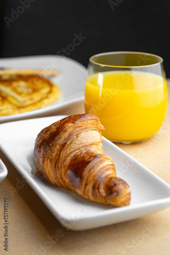 Breakfast with croissant and orange juice photo