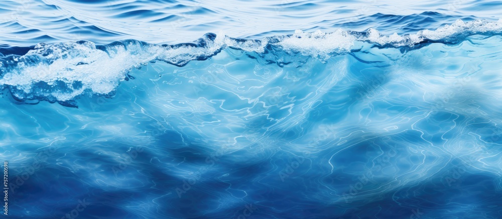 A closeup of a fluid azure wave in the ocean, shaped by the wind. The calm horizon creates a natural landscape of water and wind A closeup of a fluid azure wave in the ocean, shaped by the wind. The calm horizon creates a natural landscape of water and wind