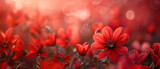 A vibrant sea of red flowers basks in the warm sunlight, creating a breathtaking natural display of colors and beauty in a tranquil field. Natural flowers background. Nature floral wallpapers
