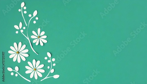 Paper flowers on green background with copy space. Flat lay, top view