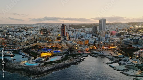 Sunset evening view of highest and modern buildings of Maltese island. St. Julians city photo